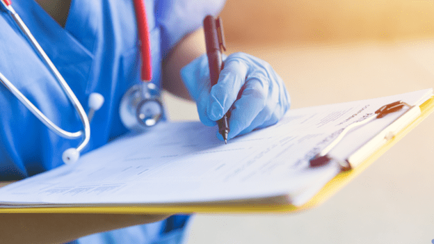 Travel nurse reviewing charts — Goodwill Staffing