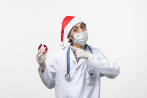 Healthcare Staffing - male nurse on mask during the holiday
