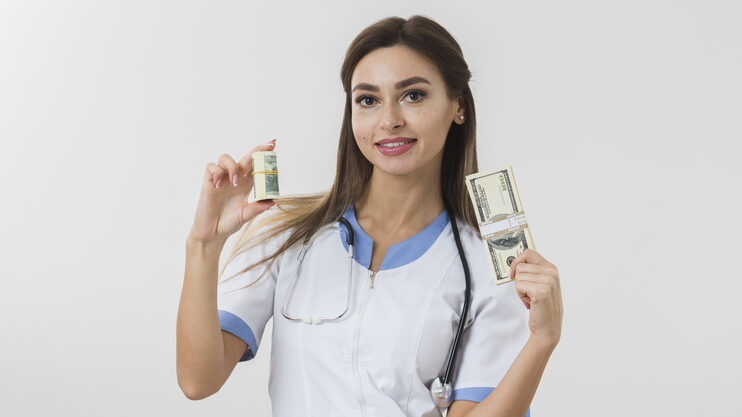 Nurses earn in canada - white nurse displaying cash